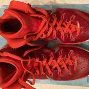 Men's red NIke athletic/B-Ball shoes size 12. Used in decent condition.